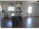 Well-lit kitchen featuring stainless steel appliances, a subway tile backsplash, and an island with seating at 210 E Monroe St, Alexandria, IN 46001