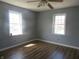 Room with a ceiling fan and lots of natural light at 210 E Monroe St, Alexandria, IN 46001