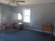 Room with a ceiling fan and lots of natural light at 210 E Monroe St, Alexandria, IN 46001
