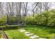 A spacious backyard featuring a trampoline and lush greenery, perfect for recreation and Gathering fun at 222 E 71St St, Indianapolis, IN 46220