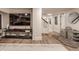 Basement featuring a large screen TV, play kitchen set, and hardwood floors, perfect for entertainment at 222 E 71St St, Indianapolis, IN 46220