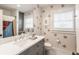 Stylish bathroom with decorative wallpaper and gray vanity at 222 E 71St St, Indianapolis, IN 46220