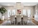 Dining room with bright natural light and designer light fixture at 222 E 71St St, Indianapolis, IN 46220
