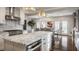 Open kitchen and dining room with stainless steel appliances and granite counters at 222 E 71St St, Indianapolis, IN 46220