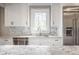 Updated kitchen with white cabinets, stone countertops and stainless steel appliances at 222 E 71St St, Indianapolis, IN 46220