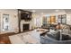 Cozy living room with a fireplace, a large sectional sofa, and elegant decor at 222 E 71St St, Indianapolis, IN 46220