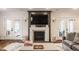 Bright living room featuring a fireplace, French doors, and stylish furnishings at 222 E 71St St, Indianapolis, IN 46220