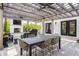 Charming patio featuring a wooden pergola, outdoor seating, a fireplace, and a grill for outdoor entertainment at 222 E 71St St, Indianapolis, IN 46220