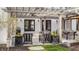 Charming outdoor patio under pergola, complemented by stylish seating and beautiful floral arrangements at 222 E 71St St, Indianapolis, IN 46220