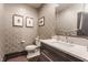 Stylish powder room with unique wallpaper and modern fixtures at 222 E 71St St, Indianapolis, IN 46220