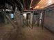 Exposed pipes, utilities, and foundation can be found in this unfinished basement at 2250 N Capitol Ave, Indianapolis, IN 46208