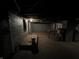 Unfinished basement with exposed brick, utilities, and a table at 2250 N Capitol Ave, Indianapolis, IN 46208