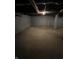 Unfinished basement with brick foundation and concrete floors at 2250 N Capitol Ave, Indianapolis, IN 46208