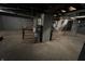 View of unfinished basement with utilities, brick foundation, and concrete floors at 2250 N Capitol Ave, Indianapolis, IN 46208
