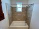This bathroom includes a shower-tub combination with tiled walls at 2250 N Capitol Ave, Indianapolis, IN 46208