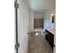 Bathroom features a bath tub, shower, toilet, and vanity with dark cabinets, and marble-look tile flooring at 2250 N Capitol Ave, Indianapolis, IN 46208