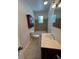 Bathroom with a vanity sink, a cabinet, and tiled shower-tub combination at 2250 N Capitol Ave, Indianapolis, IN 46208