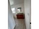 Cherry vanity with granite counters, white walls, and neutral tile floors provide this bathroom with ample storage at 2250 N Capitol Ave, Indianapolis, IN 46208