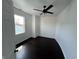 Bedroom with dark hardwood floors, white walls and ceiling fan at 2250 N Capitol Ave, Indianapolis, IN 46208