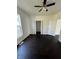 A bright, well-lit bedroom with hardwood floors, a ceiling fan, and a closet at 2250 N Capitol Ave, Indianapolis, IN 46208