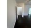 The bedroom includes hardwood floors, neutral walls, and closet storage at 2250 N Capitol Ave, Indianapolis, IN 46208