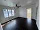 Bedroom features hardwood floors, a ceiling fan, and a large window for natural light at 2250 N Capitol Ave, Indianapolis, IN 46208