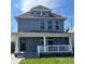 Charming two-story home with a covered porch and well-maintained lawn at 2250 N Capitol Ave, Indianapolis, IN 46208