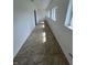 Inviting hallway with tiled flooring and multiple windows, offering views of the outdoors at 2250 N Capitol Ave, Indianapolis, IN 46208