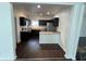 Modern kitchen with stainless steel appliances and dark cabinets at 2250 N Capitol Ave, Indianapolis, IN 46208