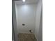 This simple laundry room includes hookups and neutral walls at 2250 N Capitol Ave, Indianapolis, IN 46208