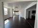 Open-concept living room with dark hardwood floors and white walls at 2250 N Capitol Ave, Indianapolis, IN 46208