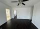 Spacious living room boasts dark hardwood floors, neutral walls, and ample natural light at 2250 N Capitol Ave, Indianapolis, IN 46208