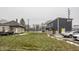 Backyard featuring a grassy lawn and a two-story home with parking space available at 2329 Shelby St, Indianapolis, IN 46203
