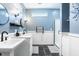 Modern bathroom featuring double sinks, sleek fixtures, and a glass-enclosed shower for a spa-like experience at 2329 Shelby St, Indianapolis, IN 46203