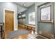 Modern entry area with hardwood floors, bench seating, and contemporary decor, providing a stylish welcome at 2329 Shelby St, Indianapolis, IN 46203