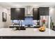 Modern kitchen with a large island, seating, and stainless steel appliances at 2329 Shelby St, Indianapolis, IN 46203