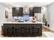 Modern kitchen with stainless steel appliances, a large island, and sleek cabinetry at 2329 Shelby St, Indianapolis, IN 46203
