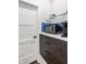 Compact kitchen nook with microwave, Keurig, and stylish storage, perfect for coffee and quick meals at 2329 Shelby St, Indianapolis, IN 46203
