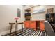 Charming kitchenette with coral cabinets, a retro refrigerator, and unique table for a vintage aesthetic at 2329 Shelby St, Indianapolis, IN 46203