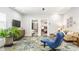 Cozy living room with comfortable seating and a view into the adjacent bedroom through double doors at 2329 Shelby St, Indianapolis, IN 46203