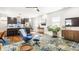 Spacious living room with a view of the open-concept kitchen, modern furnishings, and stylish decor at 2329 Shelby St, Indianapolis, IN 46203