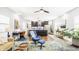 Open concept living area with sleek kitchen, comfortable seating, and hardwood floors at 2329 Shelby St, Indianapolis, IN 46203