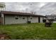 Spacious backyard featuring a home with siding, well-kept lawn, and mature trees at 248 Parkview Dr, Whiteland, IN 46184