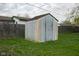 Backyard shed with aged metal siding, providing secure storage and practical functionality to the outdoor space at 248 Parkview Dr, Whiteland, IN 46184