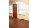Entryway featuring a solid front door with side windows and hardwood flooring at 248 Parkview Dr, Whiteland, IN 46184