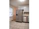 Bright kitchen featuring stainless steel appliances, tile backsplash, and ample counter space at 248 Parkview Dr, Whiteland, IN 46184
