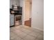Well-lit kitchen featuring stainless steel oven and microwave with gray cabinets and tile backsplash at 248 Parkview Dr, Whiteland, IN 46184