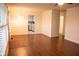 Open-concept living area showcasing hardwood floors and a view into the kitchen at 248 Parkview Dr, Whiteland, IN 46184