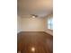 Spacious living room showcasing hardwood floors and natural light through the window at 248 Parkview Dr, Whiteland, IN 46184