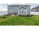 Expansive backyard featuring a well-manicured lawn, patio area, and privacy fence, ideal for outdoor living and recreation at 2536 Maricopa Blvd, Whitestown, IN 46075